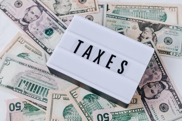 heap of american money cash and vintage light box.jpg